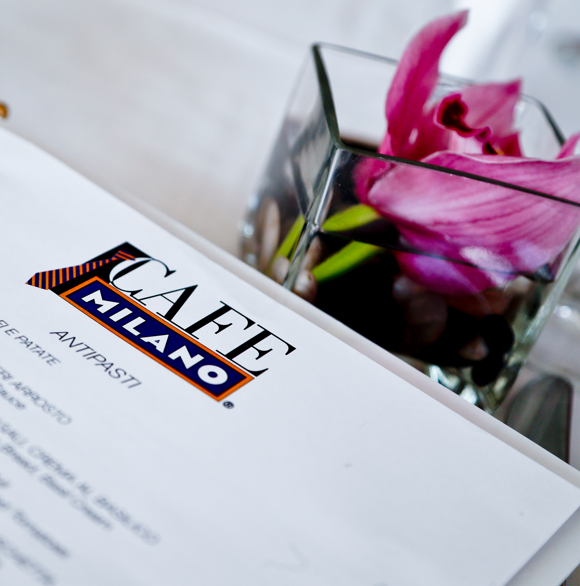 Cafe Milano menu with flower